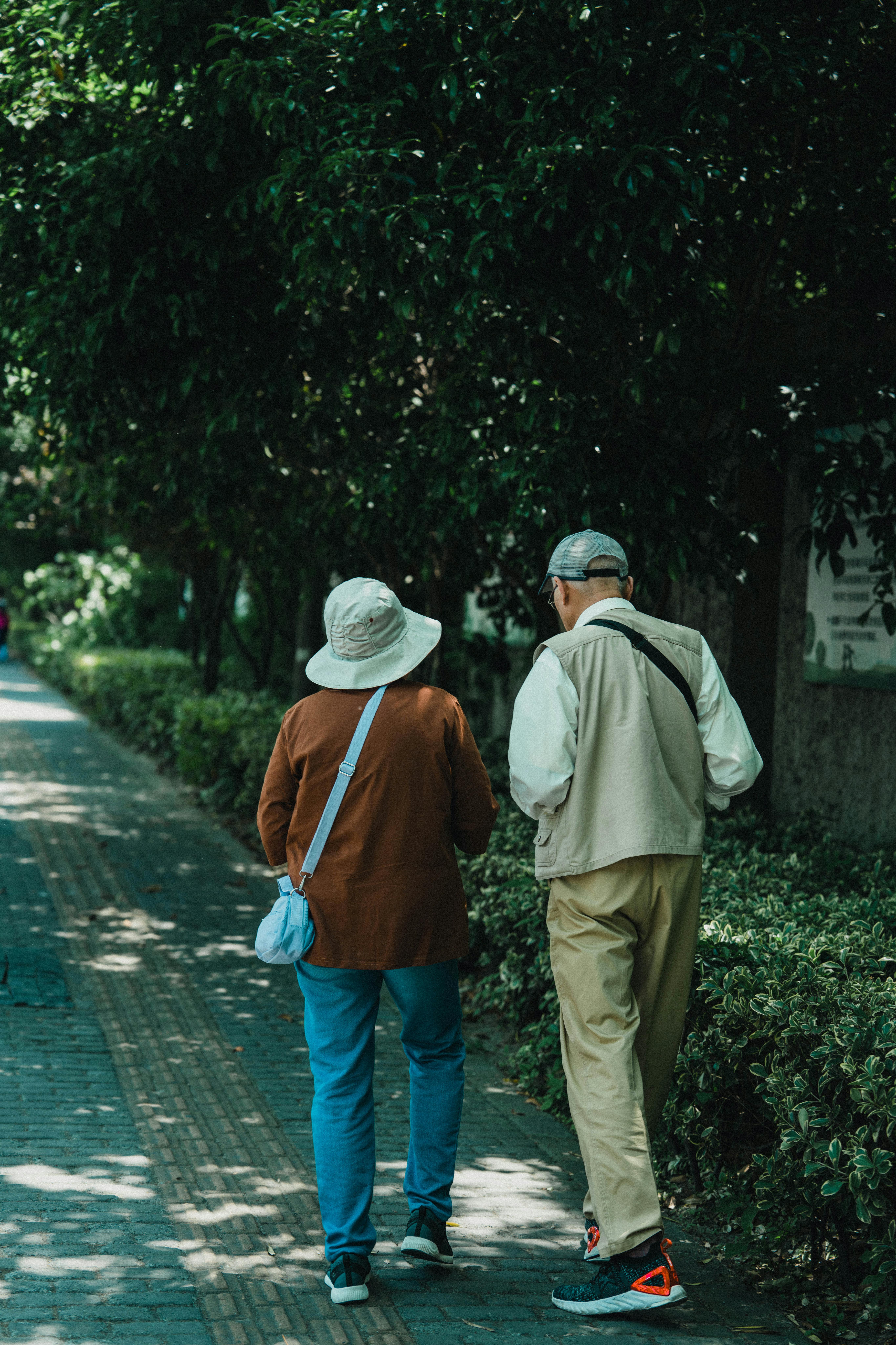 Elderly man and wife walking on a sidewalk together. Rediscover prayer in ordinary moments.